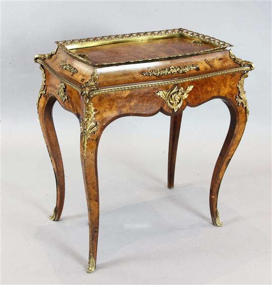 A Victorian ormolu mounted figured walnut jardinere, W.2ft 5in. D.1ft 7in. H.2ft 8in.